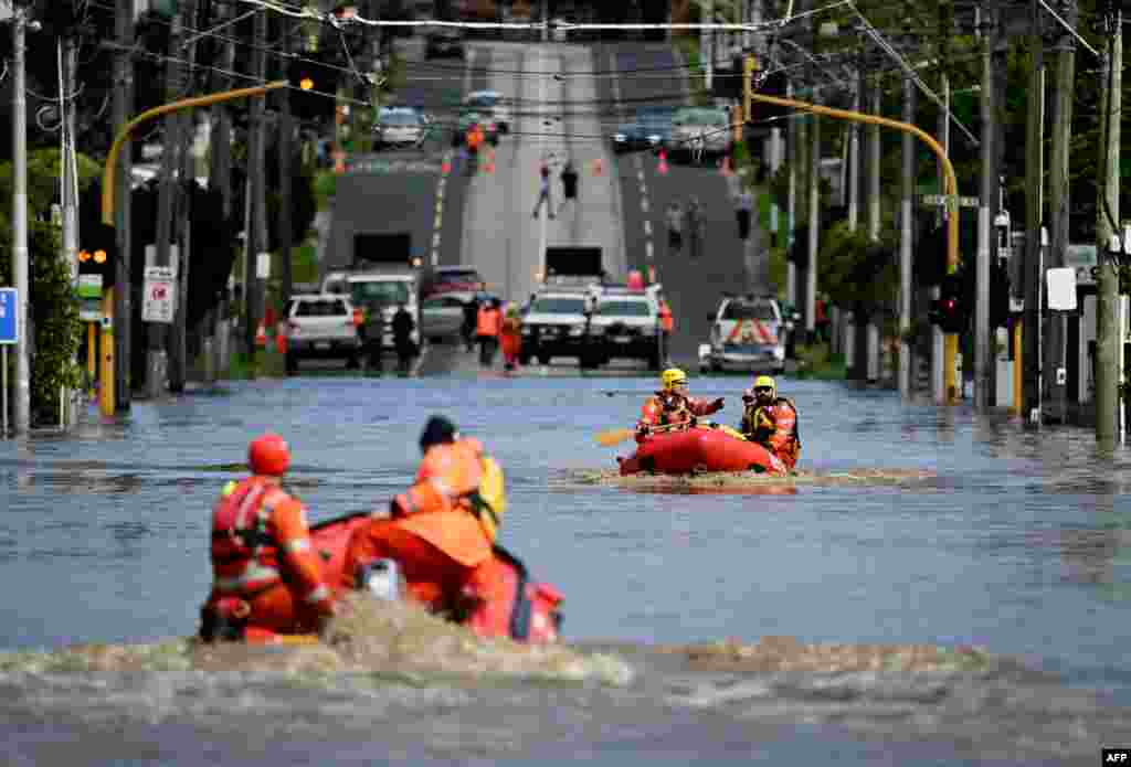 Emergency workers patrol a flooded area as they evacuate residents in the Melbourne suburb of Maribyrnong, Australia.