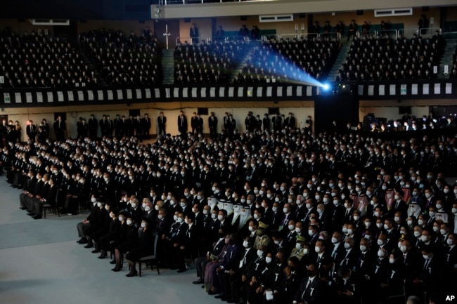 Hundreds of guests attend the state funeral for slain former Prime Minister Shinzo Abe, Tuesday, Sept. 27, 2022, in Tokyo. (Leah Millis/Pool Photo via AP)