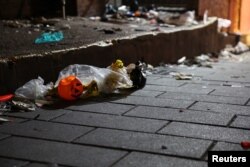 Debris is seen at the scene where many people died and were injured in a stampede during a Halloween festival in Seoul, South Korea, Oct. 30, 2022