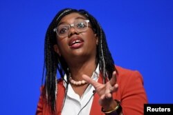 FILE - British Secretary of State for International Trade Kemi Badenoch speaks during Britain's Conservative Party's annual conference in Birmingham, Britain, Oct. 3, 2022.