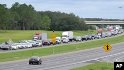 Eastbound traffic crowds Florida's Interstate 4 as people evacuate in preparation for Hurricane Ian approaches the western side of the state, Sept. 27, 2022, in Lake Alfred, Fla.