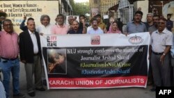 Media representatives shout slogans during a protest in Karachi on Oct. 24, 2022, against the killing of Pakistani news anchor Arshad Sharif in Kenya. 