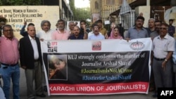 Media representatives shout slogans during a protest in Karachi on Oct. 24, 2022, condemning the killing in Kenya of Pakistani journalist Arshad Sharif.
