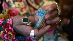 Zoltan Sztojka, traditional Gypsy fortune-teller holding his cards in his hand in Soltvadkert, central Hungary on Oct. 10, 2021.