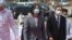 Taiwan's President Tsai Ing-wen, center, walks to take part in a launch ceremony for its first indigenous amphibious transport dock in Kaohsiung, southern Taiwan, Tuesday, April 13, 2021. (AP Photo/Chiang Ying-ying)