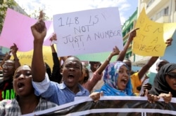 FILE - University students join a demonstration condemning the gunmen attack at the Garissa University campus, in the Kenyan coastal port city of Mombasa, April 8, 2015.