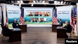 U.S. President Joe Biden, U.S. Secretary of Agriculture Tom Vilsack and U.S. Attorney General Merrick Garland attend a video conference with farmers, ranchers and meat processors to discuss meat and poultry supply chain issues, on the White House campus, Jan. 3, 2022.