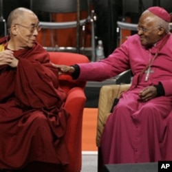 A 2008 file photo shows the Dalai Lama (L) with Archbishop Desmond Tutu of South Africa at the University of Washington in Seattle.