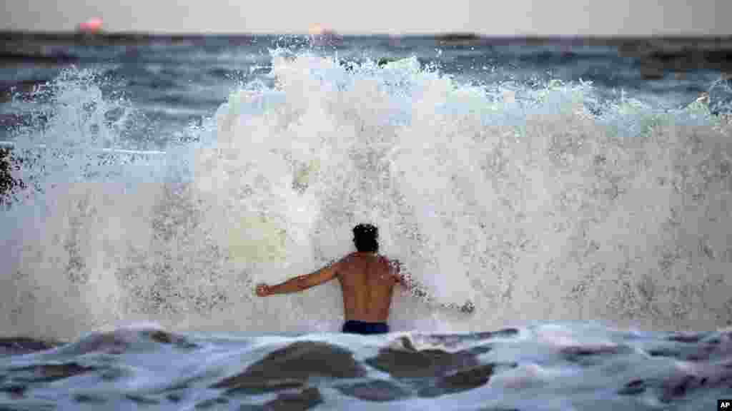 Body surfer Andrew Vanotteren crashes into waves generated from Hurricane Florence, Sept. 12, 2018, on the south beach of Tybee Island, Georgia.