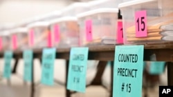 Counted ballots for various precincts are displayed at the Flathead County Fairgrounds in Kalispell, Mont., on Nov. 9, 2022. 