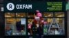 A pedestrian walks past a branch of Oxfam, in London, Feb. 12, 2018. 