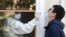 Serbia နိုင်ငံ Belgrade မြို့မှာ ကိုဗစ်စစ်ဆေးပေးနေတဲ့ မြင်ကွင်း။ (ဒီဇင်ဘာ ၂၂၊ ၂၀၂၀)