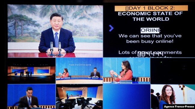 This handout picture taken and released on Nov. 11, 2021, by APEC New Zealand shows China's President Xi Jinping, top left, appearing on a screen via video link during the virtual business conference on the sidelines of the Asia-Pacific Economic Cooperati
