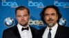 Leonardo DiCaprio (kiri) pemeran utama film "The Revenant" berpose dengan dutradara Alejandro Gonzalez Inarritu dalam ajang Directors Guild of America Awards ke-68 di Hyatt Regency Century Plaza, Los Angeles (6/2).