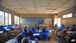 Pupils at the Olympic primary school sit in class on without a teacher on the third day of a teachers' strike organized by the Kenya National Union of Teachers, in Nairobi, Kenya, September 7, 2011.