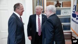 FILE - In this image provided by the Russian Foreign Ministry, President Donald Trump meets with Russian Foreign Minister Sergey Lavrov, left, and then-Russian Ambassador to the U.S. Sergei Kislyak, at the White House in Washington, on May 10, 2017.