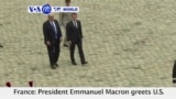 VOA60 World PM -French President Emmanuel Macron greets U.S. President Donald Trump at the Elysee palace