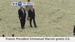 VOA60 World PM -French President Emmanuel Macron greets U.S. President Donald Trump at the Elysee palace