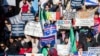 A crowd is seen gathered in front of the White House urging President Joe Biden to expand work permits for long-term immigrants, in Washington, Nov. 14, 2023. (Joy Asico/AP Images for ABIC Action)