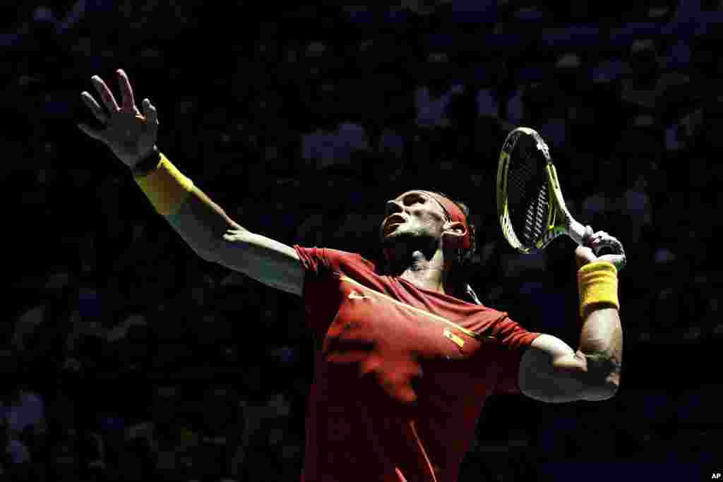 Rafael Nadal of Spain prepares to return against Japan's Yoshihito Nishioka during their ATP Cup tennis match in Perth, Australia.