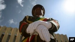 A member of a military marching band attends a ceremony to remember soldiers who died on the first day of the Tigray conflict, outside the city administration office in Addis Ababa, Ethiopia, Nov. 3, 2022.