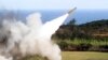 FILE - A HAWK surface-to-air missile is test-fired from Jeoupeng military base in Taiwan, Jan. 18, 2011. Refurbished missiles, T-72B tanks and other weaponry are part of the $400 million in security assistance headed for Ukraine, U.S. officials announced 