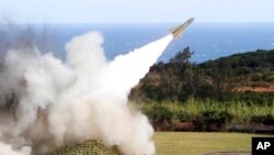 FILE - A HAWK surface-to-air missile is test-fired from Jeoupeng military base in Taiwan, Jan. 18, 2011. Refurbished missiles, T-72B tanks and other weaponry are part of the $400 million in security assistance headed for Ukraine, U.S. officials announced 