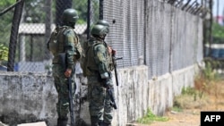 Ecuadorian soldiers guard the outskirts of the Litoral Penitentiary in Guayaquil, Ecuador, Nov. 4, 2022.