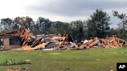Scenes of devastation are visible in all directions along Lamar County Road 35940, west of State Highway 271, after a massive tornado hit the area, causing extensive damage and destroying an unknown number of homes, Nov. 4, 2022 in Powderly, Texas. 