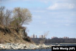 Hi-rise buildings from Co-op City in the Bronx borough of New York, are seen behind what is believed to be a water storage system dating back to the American Civil War on Hart Island in New York.