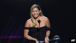 Snowboarder Chloe Kim accepts the award for best female athlete at the ESPY Awards at the Microsoft Theater on Wednesday, July 18, 2018, in Los Angeles. (Photo by Phil McCarten/Invision/AP)