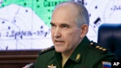 Col. Gen. Sergei Rudskoi of the military's General Staff speaks during a briefing in the Russian Defense Ministry in Moscow, Russia, Saturday, April 14, 2018.