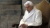 FILE - Pope Emeritus Benedict XVI sits in St. Peter's Basilica as he attends a ceremony marking the start of the Holy Year, at the Vatican, Dec. 8, 2015. 