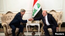 Wezîrê Derve yê Amerîka John Kerry û Serokwezîrê Îraqê Hayder el Abadî 