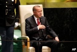 Turkey's President Recep Tayyip Erdogan waits to address the 74th session of the United Nations General Assembly, Sept. 24, 2019.