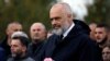 Albania's Prime Minister Edi Rama attends the funeral of six members of the Cara family, killed during an earthquake that shook Albania, in Thumane, Albania, Nov. 29, 2019. 