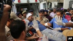 An Indian Hindu pilgrim injured in a bus accident is brought for treatment at a hospital in Jammu, India, July 16, 2017.