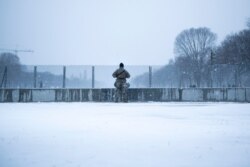 On Feb. 1, 2021, a member of the National Guard watches over the National Mall after increased security measures put in place after the Jan. 6 attack on the Capitol Building.