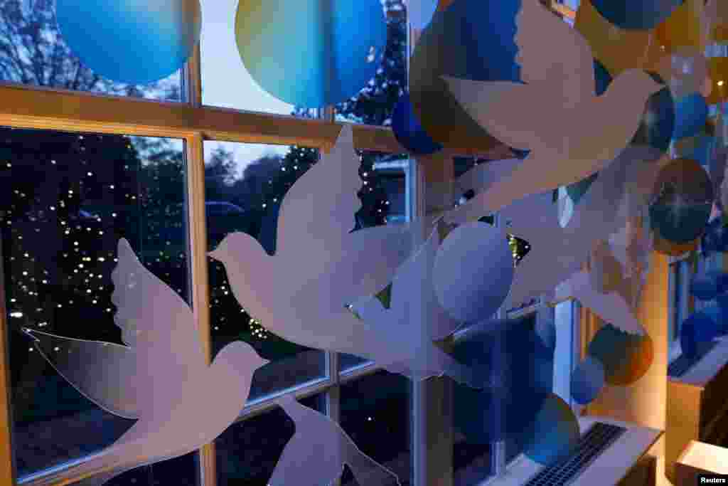 Doves and shooting stars decorate the East Colonnade of the White House during a press event for the Christmas decorations, ahead of holiday receptions by U.S. President Joe Biden and first lady Jill Biden in Washington, U.S. November 29, 2021. REUTERS/Jonathan Ernst