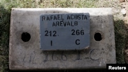 The name of Rafael Acosta Arevalo, a navy captain who died while in detention according to his family, is seen at his grave after a burial at a cemetery in Caracas, Venezuela, July 10, 2019.