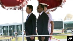 Italian Premier Giuseppe Conte, left, and Ethiopian Prime Minister Abiy Ahmed Ali stand attention at they review the guard of honor, in Addis Ababa, Ethiopia, on the occasion of an official visit, Oct. 11, 2018.