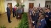 President Barack Obama says the Pledge of Allegiance during a naturalization ceremony for active duty service members in the East Room of the White House, July 4, 2012. 