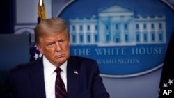 President Donald Trump listens to a question during a briefing with reporters in the James Brady Press Briefing Room of the White House, Tuesday, Aug. 4, 2020, in Washington.(AP Photo/Alex Brandon)