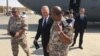 Menhan AS Jim Mattis (tengah) ketika tiba di Pangkalan Udara Al Udeid, Qatar hari Kamis (28/9). 