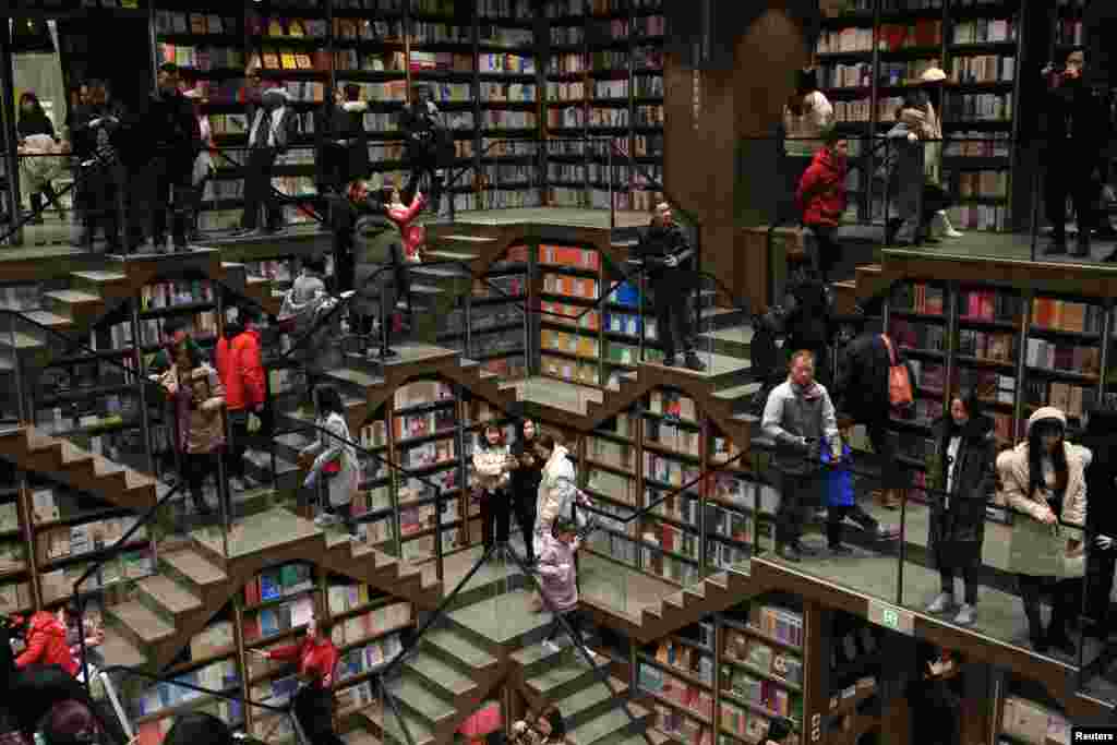 Visitors take in their surroundings at a newly opened bookstore in Chongqing, China, Jan. 29, 2019.