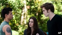 Taylor Lautner, left, Kristen Stewart and Robert Pattinson star in "The Twilight Saga: Eclipse"