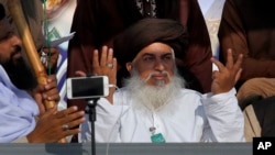 Head of the Pakistani Tehreek-e-Labaik radical religious party, Khadim Hussain Rizvi, gestures during a sit-in protest near the capital, Islamabad, Nov. 20, 2017.