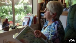 Joan Davies Rapp of Tacoma, Washington, counts and records bird sightings outside her living room window as part of Project FeederWatch. (VOA/T. Banse)