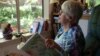 Joan Davies Rapp of Tacoma, Washington, counts and records bird sightings outside her living room window as part of Project FeederWatch.