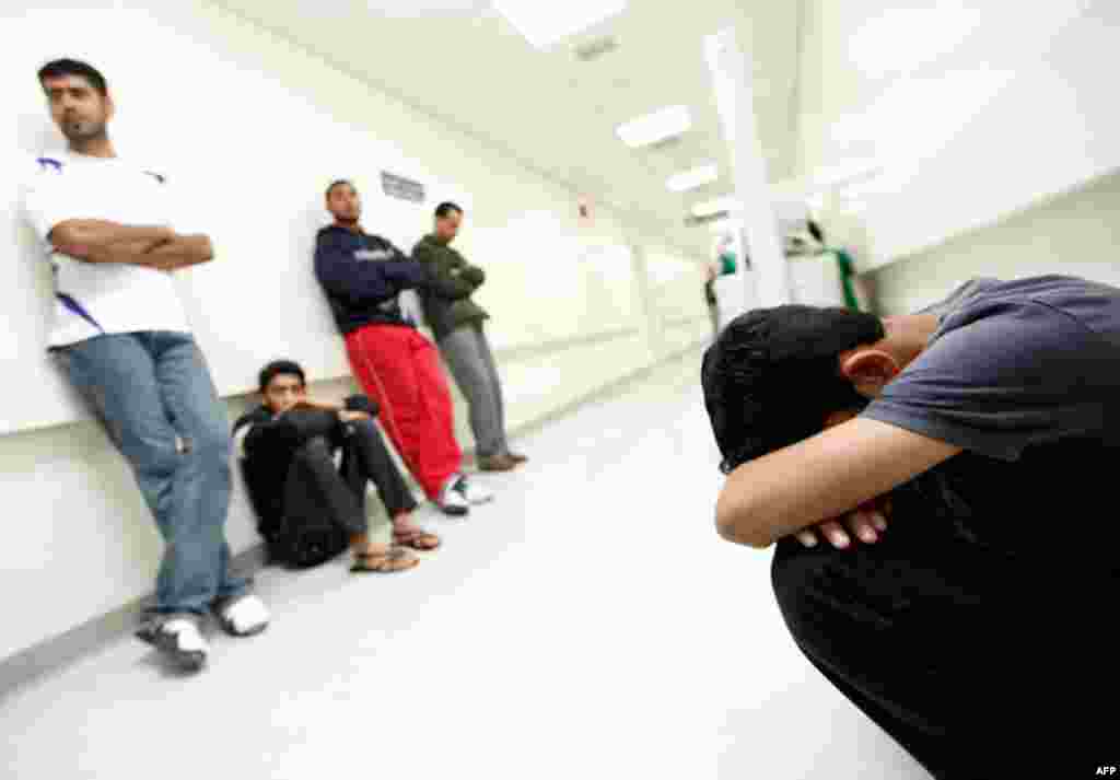 People wait at the Salmaniya hospital to hear about the well-being of their family members who were injured in Manama. (Reuters/Hamad I Mohammed)